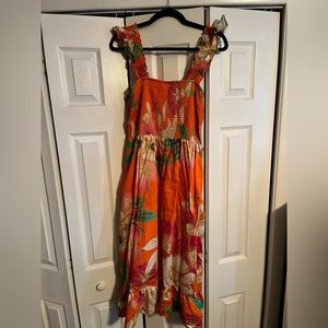 Tropical smocked midi dress - perfect for your next island vacation!